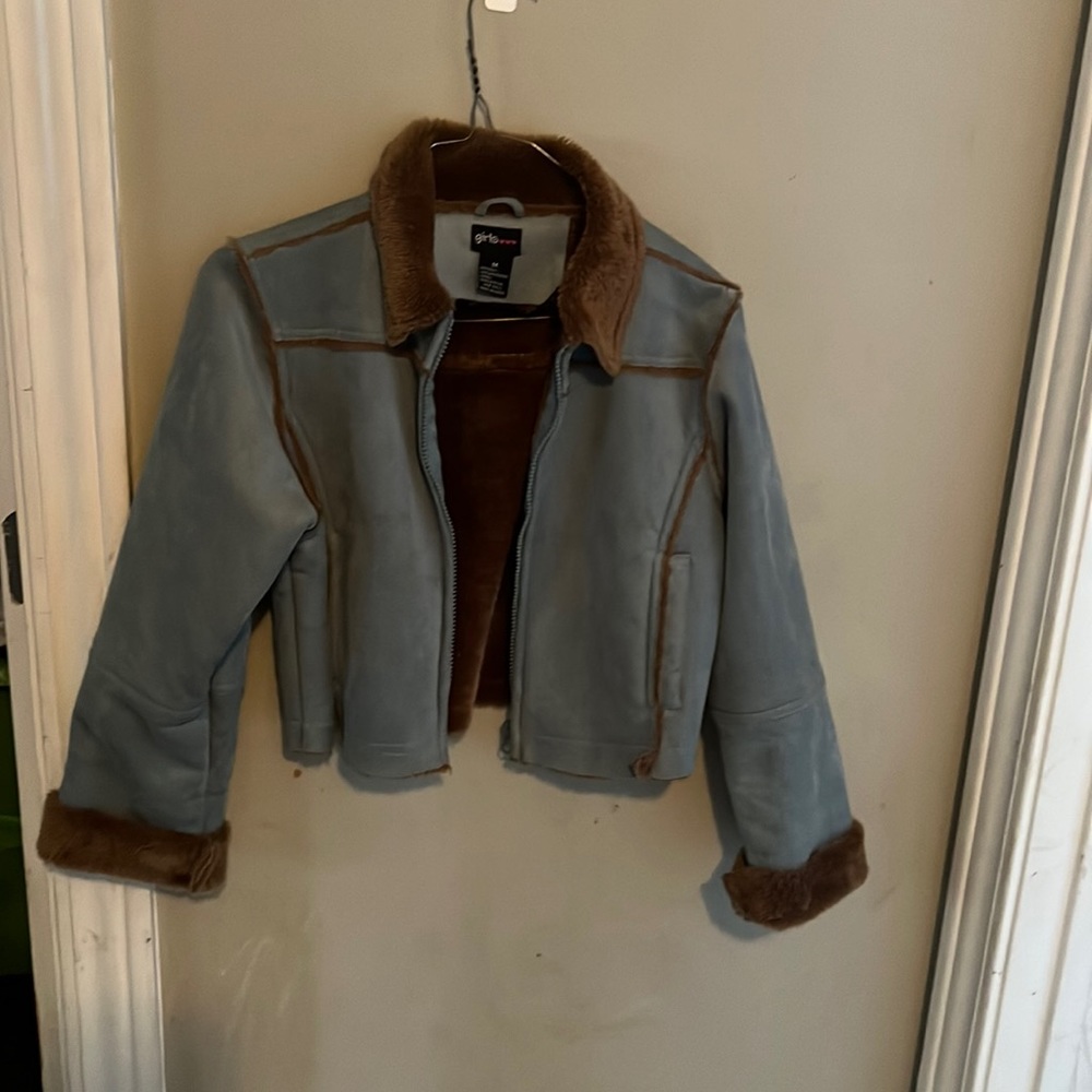 Jacket feels like suede outside and fur in the inside